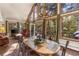 Inviting dining area with large windows, chandelier and access to an outdoor patio at 609 Brook Dr, Idaho Springs, CO 80452