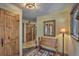 Inviting foyer with wooden bench, mirror, decorative lighting and wood accents at 609 Brook Dr, Idaho Springs, CO 80452