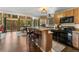 Spacious kitchen with eat-in breakfast nook, wooden bar with stools and stainless appliances at 609 Brook Dr, Idaho Springs, CO 80452