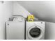 The laundry room features a washer and dryer with storage space for laundry products at 609 Brook Dr, Idaho Springs, CO 80452