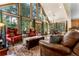 Bright, spacious living room with large windows and inviting seating, open layout at 609 Brook Dr, Idaho Springs, CO 80452