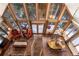 Stunning living room with expansive windows, fireplace, and hardwood floors offers cozy charm and scenic views at 609 Brook Dr, Idaho Springs, CO 80452