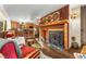 Cozy living room flows into a well-equipped kitchen, creating an open and inviting space for entertaining at 609 Brook Dr, Idaho Springs, CO 80452