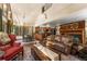 Spacious living area with fireplace open to the kitchen, ideal for Gathering gatherings and entertaining at 609 Brook Dr, Idaho Springs, CO 80452
