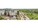 Panoramic view of an apartment building and a rail station in a vibrant neighborhood at 1208 Quitman St # 305, Denver, CO 80204