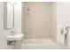 Clean bathroom featuring a tub/shower and bright, modern tiling at 1208 Quitman St # 305, Denver, CO 80204