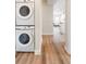Conveniently stacked washer and dryer with easy access to the home's living areas at 1208 Quitman St # 305, Denver, CO 80204