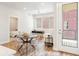 Cozy living area with a dining area, view to balcony, and stylish decor at 1208 Quitman St # 305, Denver, CO 80204