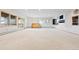 Expansive basement space with natural light and built-in shelving at 23655 Currant Dr, Golden, CO 80401
