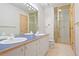 Bathroom featuring a double vanity with shower at 23655 Currant Dr, Golden, CO 80401
