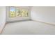 Bright bedroom with large window providing natural light and views of the surrounding area at 23655 Currant Dr, Golden, CO 80401