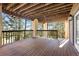Outdoor deck with wood decking and views of trees and foliage at 23655 Currant Dr, Golden, CO 80401