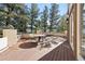 Spacious wooden deck with railing, perfect for outdoor dining and enjoying the scenic view at 23655 Currant Dr, Golden, CO 80401