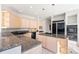 Bright kitchen featuring granite countertops, stainless steel appliances, and ample cabinet space at 23655 Currant Dr, Golden, CO 80401