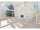 Bright living room boasts a unique fireplace, large windows, and a staircase at 23655 Currant Dr, Golden, CO 80401