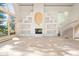 Spacious living room with fireplace, built-ins, and large windows at 23655 Currant Dr, Golden, CO 80401