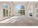 Bright and airy living room with large windows, a marble fireplace, and neutral decor at 23655 Currant Dr, Golden, CO 80401