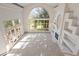 Spacious living room with a large arched window and fireplace with built-in shelving at 23655 Currant Dr, Golden, CO 80401