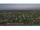 Wide aerial view of neighborhood showing many homes and mature trees at 9375 Webster Way, Westminster, CO 80021