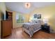 Bright bedroom features a vaulted ceiling, natural light and hardwood floors throughout at 9375 Webster Way, Westminster, CO 80021