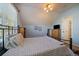 Charming bedroom features light blue walls, a cozy bed frame, and a modern ceiling fan at 9375 Webster Way, Westminster, CO 80021