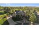 Stunning home with manicured landscaping, mature trees, circular driveway, and mountain views at 9375 Webster Way, Westminster, CO 80021