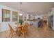 Bright kitchen with tile floors, white cabinets, and a cozy breakfast nook with natural light at 9375 Webster Way, Westminster, CO 80021
