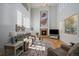Sunlit living room showcases vaulted ceiling, large windows, fireplace and hardwood flooring at 9375 Webster Way, Westminster, CO 80021