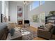 Bright living room features vaulted ceiling, large windows, fireplace and hardwood flooring at 9375 Webster Way, Westminster, CO 80021