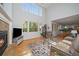 Open living room features hardwood floors, a fireplace and lots of natural light at 9375 Webster Way, Westminster, CO 80021