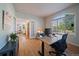 Home office features hardwood floors, lots of natural light and a comfortable work space at 9375 Webster Way, Westminster, CO 80021