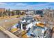 An aerial view of a modern home in a city neighborhood with roof top decks and solar panels at 3522 S Ogden St, Englewood, CO 80113