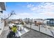 Spacious rooftop balcony with black railing and cozy furniture, perfect for entertaining at 3522 S Ogden St, Englewood, CO 80113