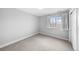 Carpeted bedroom featuring a window and neutral walls at 3522 S Ogden St, Englewood, CO 80113