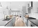 Modern kitchen with an island seamlessly opens to a bright and airy living space at 3522 S Ogden St, Englewood, CO 80113