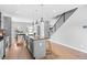 Open concept living space with kitchen island and stairs at 3522 S Ogden St, Englewood, CO 80113