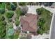 Aerial view of the property featuring landscaping, roof, and hardscape features at 8707 Windhaven Dr, Parker, CO 80134