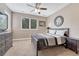 Bedroom with carpet, furniture and a ceiling fan at 8707 Windhaven Dr, Parker, CO 80134