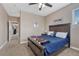 Bedroom featuring a dark wood bedframe with soft blue bedding and neutral colored walls at 8707 Windhaven Dr, Parker, CO 80134