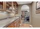 Butler's pantry features granite countertops and wooden cabinets at 8707 Windhaven Dr, Parker, CO 80134