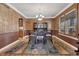 Elegant dining room with stylish decor, an ornate light fixture, and a large window at 8707 Windhaven Dr, Parker, CO 80134