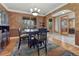 Dining area featuring an elegant light fixture and detailed wall textures at 8707 Windhaven Dr, Parker, CO 80134