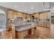 A bright kitchen with stainless steel appliances, hardwood floors and spacious countertops at 8707 Windhaven Dr, Parker, CO 80134