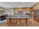 Beautiful kitchen with a large island, stainless steel appliances, and hardwood floors at 8707 Windhaven Dr, Parker, CO 80134