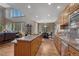 Modern kitchen with a large island, stainless steel appliances, and access to the dining area at 8707 Windhaven Dr, Parker, CO 80134