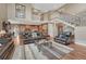 Open-concept living room with a view of the kitchen and staircase, perfect for entertaining at 8707 Windhaven Dr, Parker, CO 80134