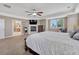 Main bedroom with fireplace, furniture, and en suite bathroom access at 8707 Windhaven Dr, Parker, CO 80134