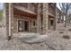 Backyard patio with stone detail and French doors at 8707 Windhaven Dr, Parker, CO 80134