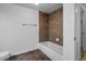 Clean bathroom with a shower/tub combo and tile surround at 2850 E College Ave # 2, Boulder, CO 80303