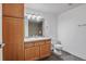 Clean bathroom with light wood cabinets and tile floor at 2850 E College Ave # 2, Boulder, CO 80303